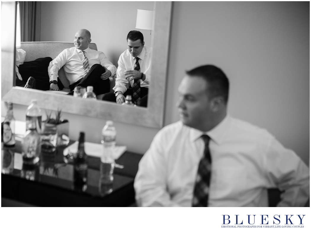 groom getting ready black and white in mirror