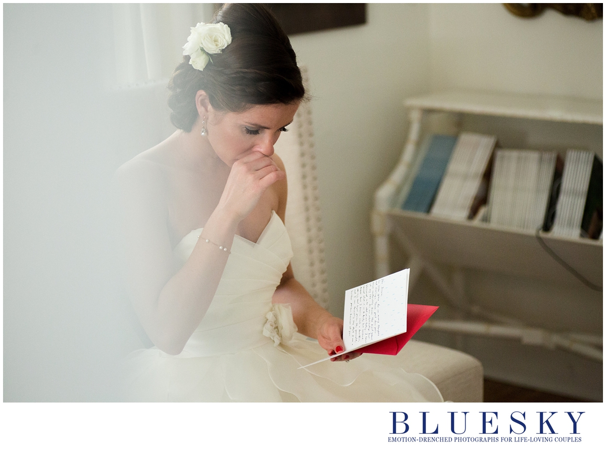 bride reading letter from groom and crying