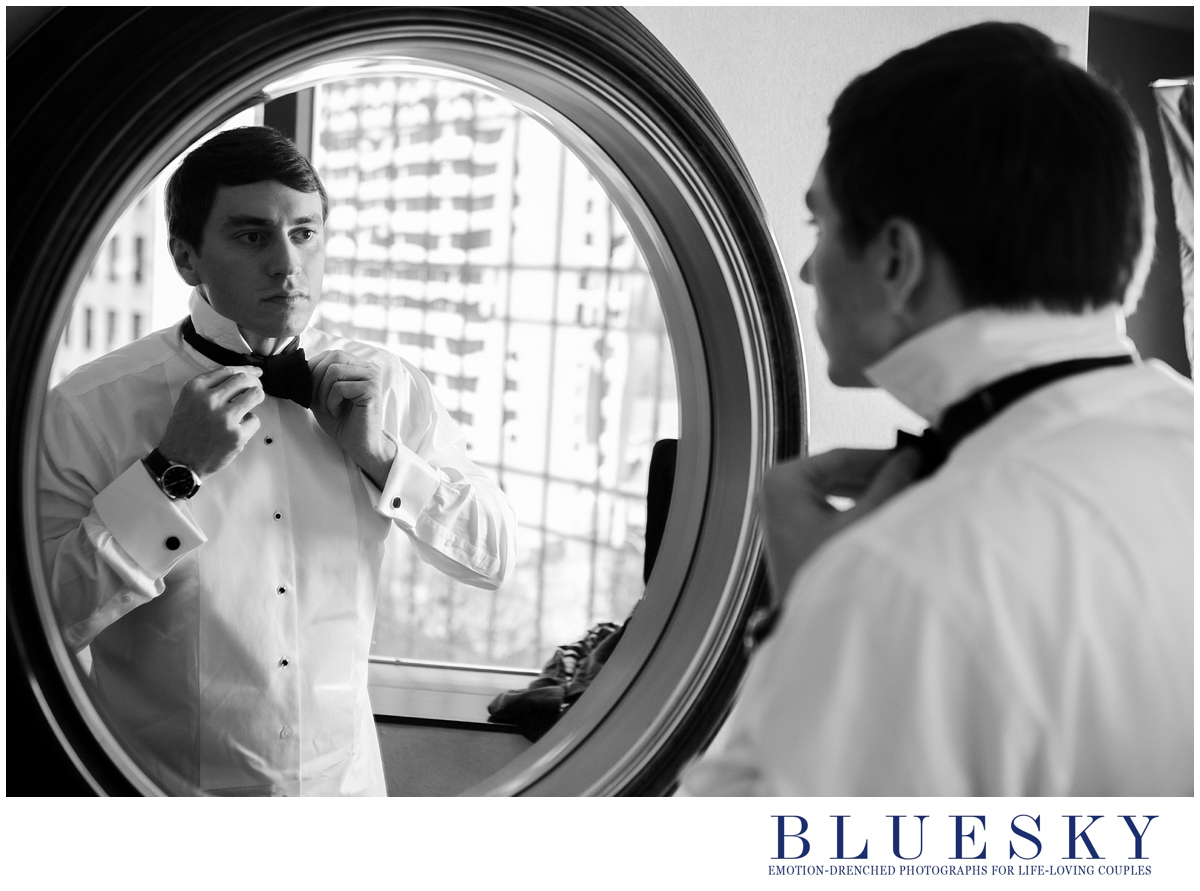 groom getting ready reflection in mirror