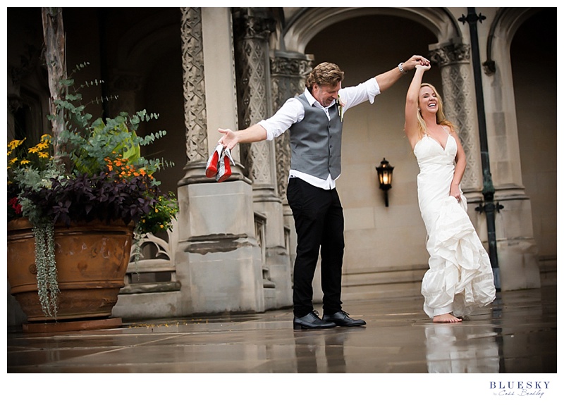 bride dancing in rain in louboutin shoes