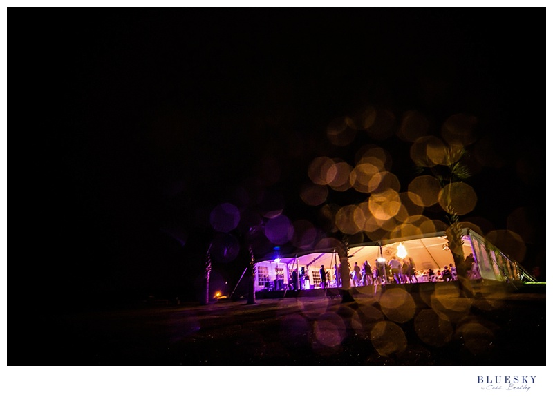 Champagne manor reception tent at night in rain