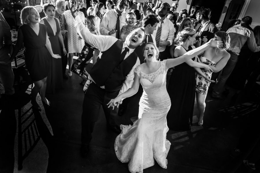 bride and groom singing on dance floor