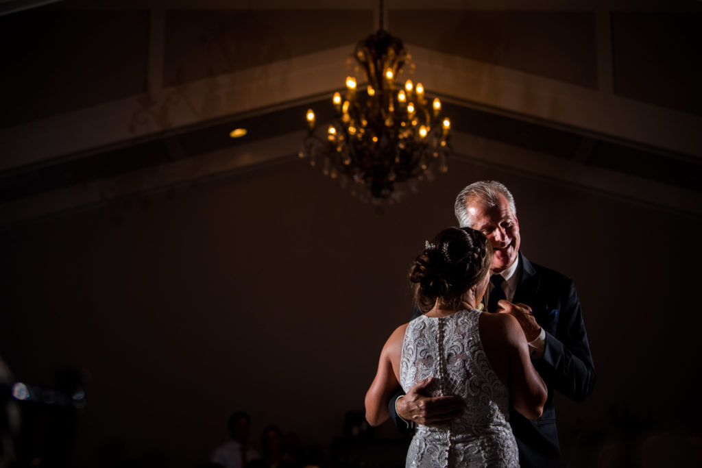 Father of the bride smiling during dance