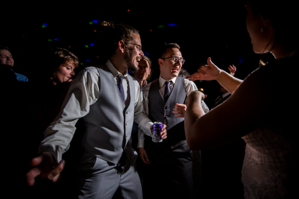 Reception dancing groom and best man