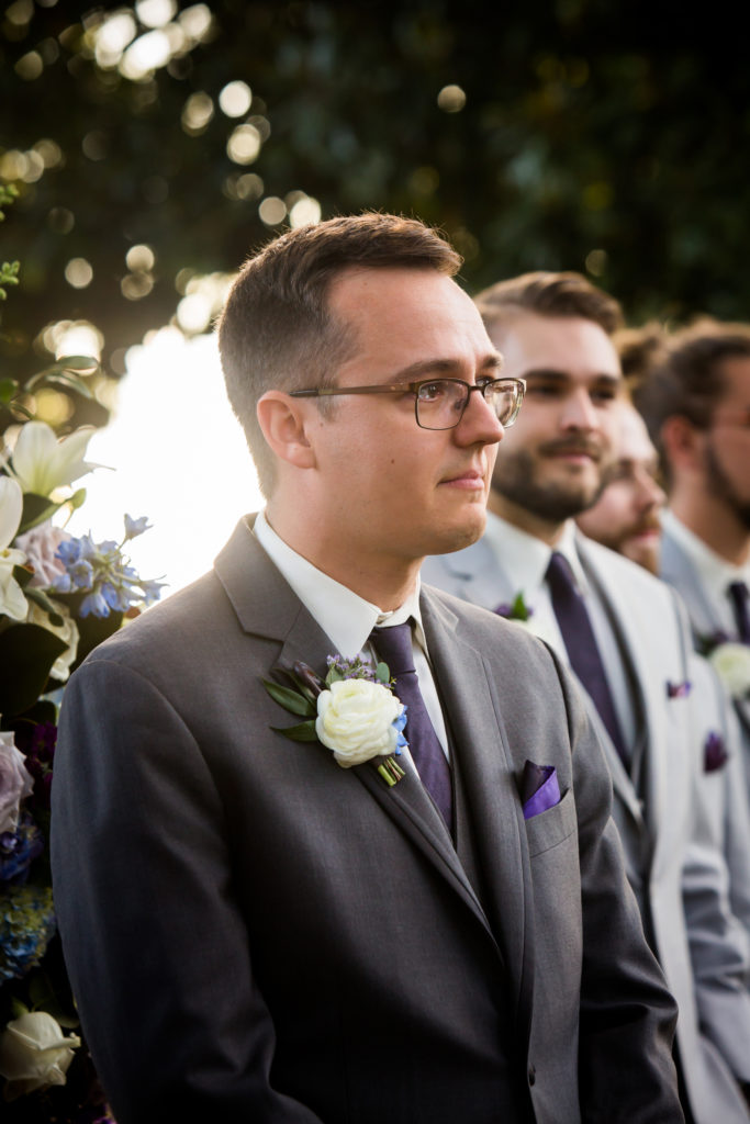 Groom crying seeing bride on the aisle