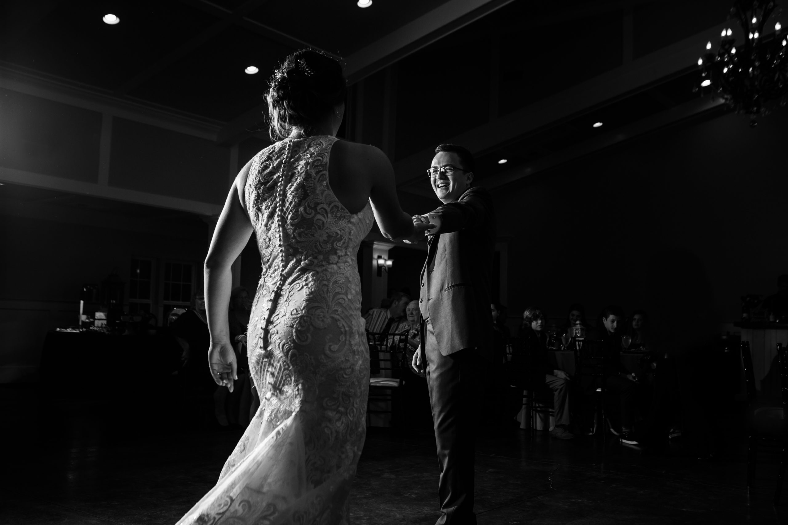 Dramatically lit bride and groom first dance