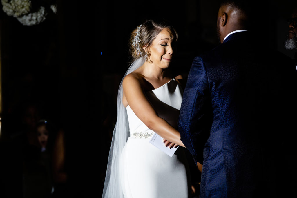 Bride cries Tears of joy during their Romantic Night Ceremony at The Mint Museum Uptown Charlotte NC