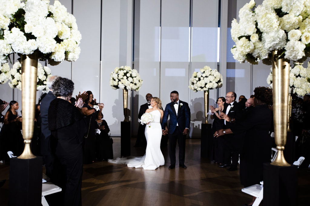 Bride and groom just announced husband and wife. Romantic Night Wedding at The Mint Museum Uptown Charlotte NC