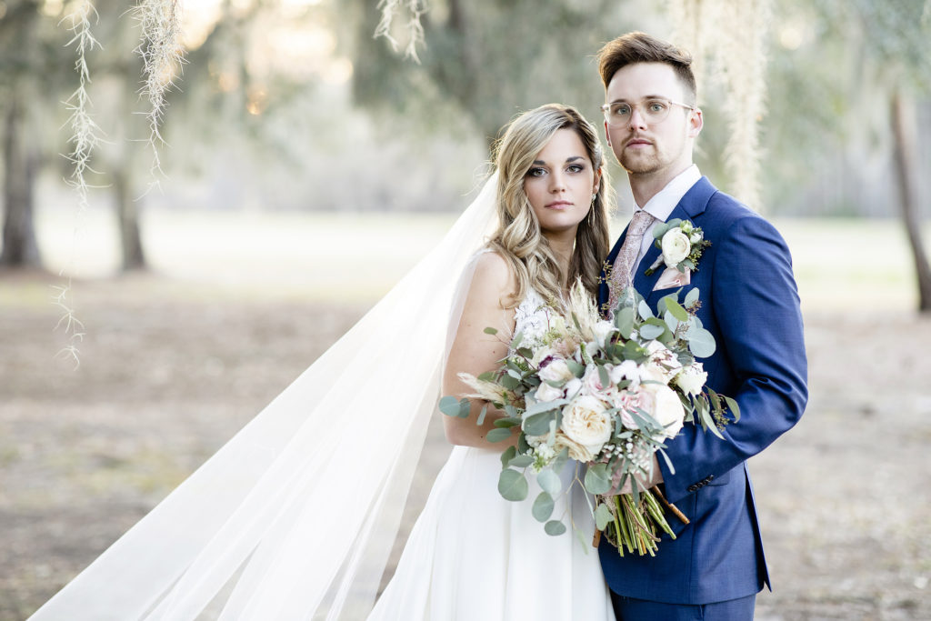 Posing ideas for bride and groom, Couple portraits. Backyard Sweet BOHO Savannah wedding in March with a ceremony in front of Spanish Moss trees