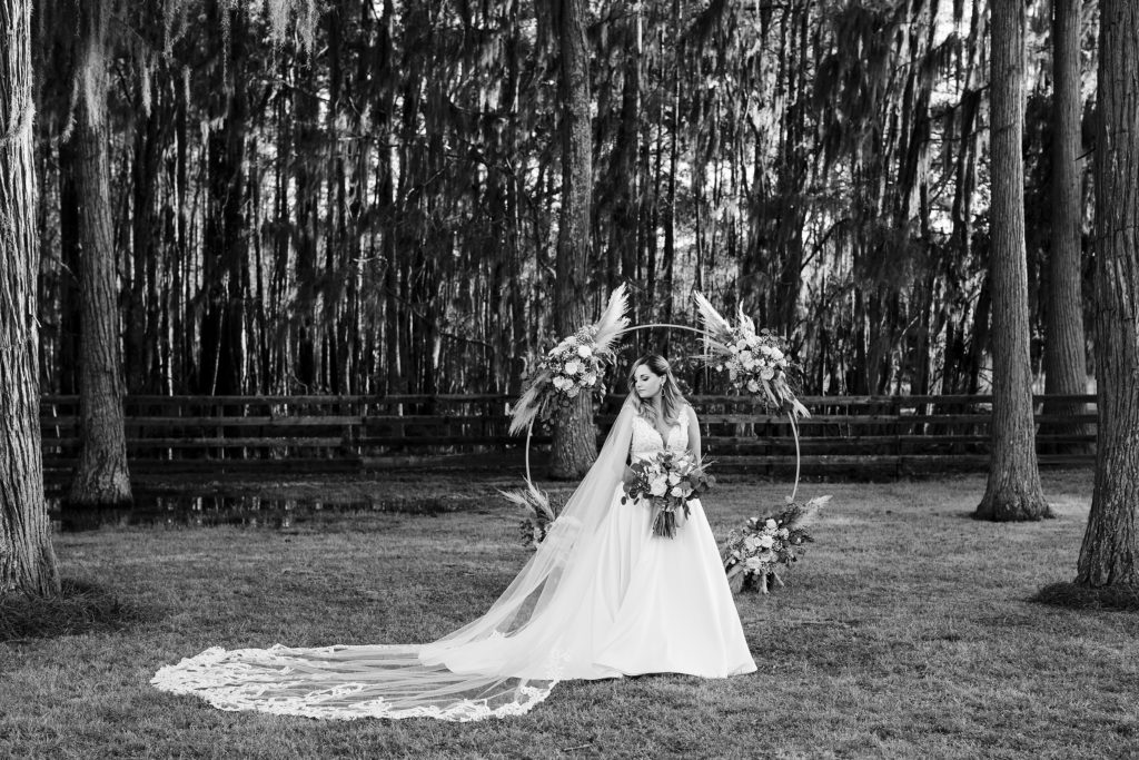 Posing ideas for bridal portraits. Backyard Sweet BOHO Savannah wedding in March with a ceremony in front of Spanish Moss trees