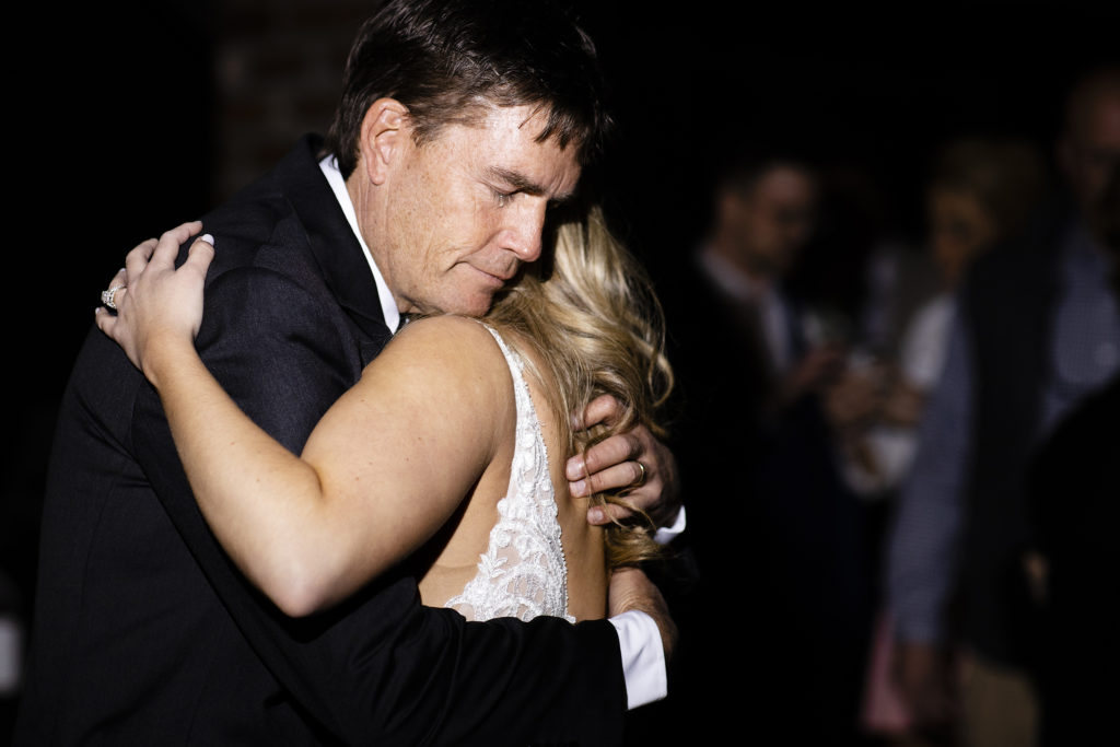 Emotional first dance between a bride and her father. Father daughter dance at a wedding 