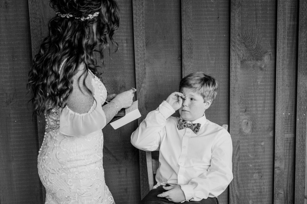mother and son have a moment on her wedding day