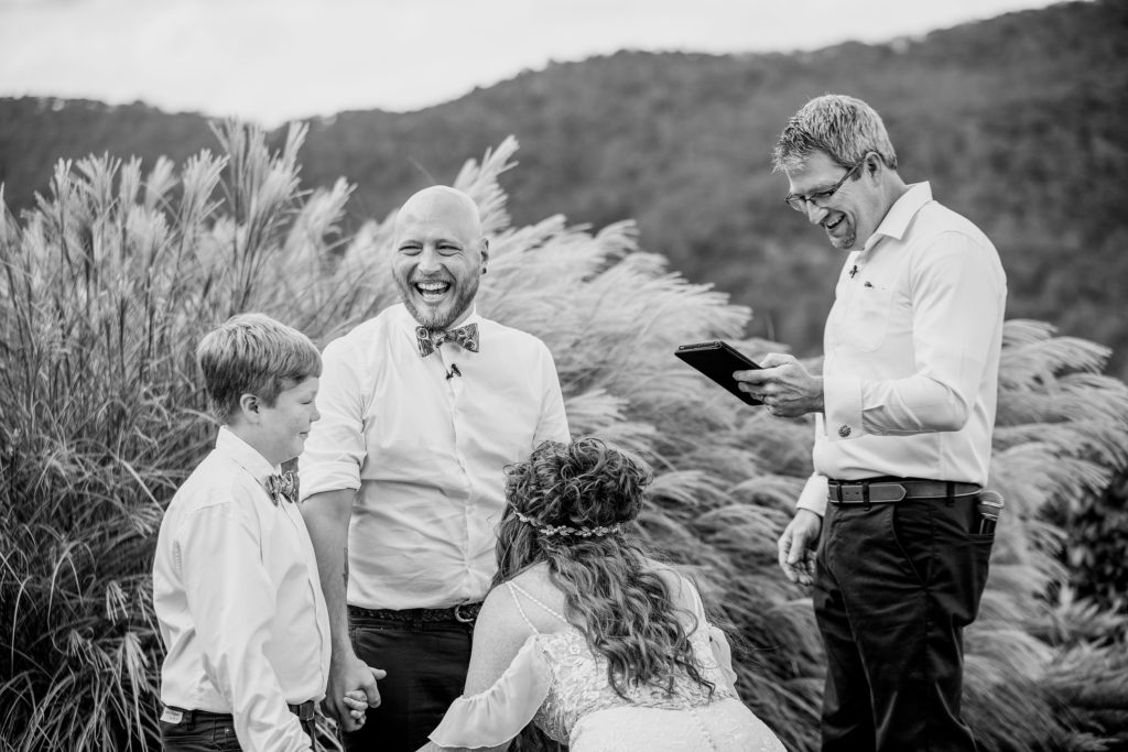 funny moment during their wedding ceremony. Intimate micro wedding in the blue ridge parkway in asheville nc