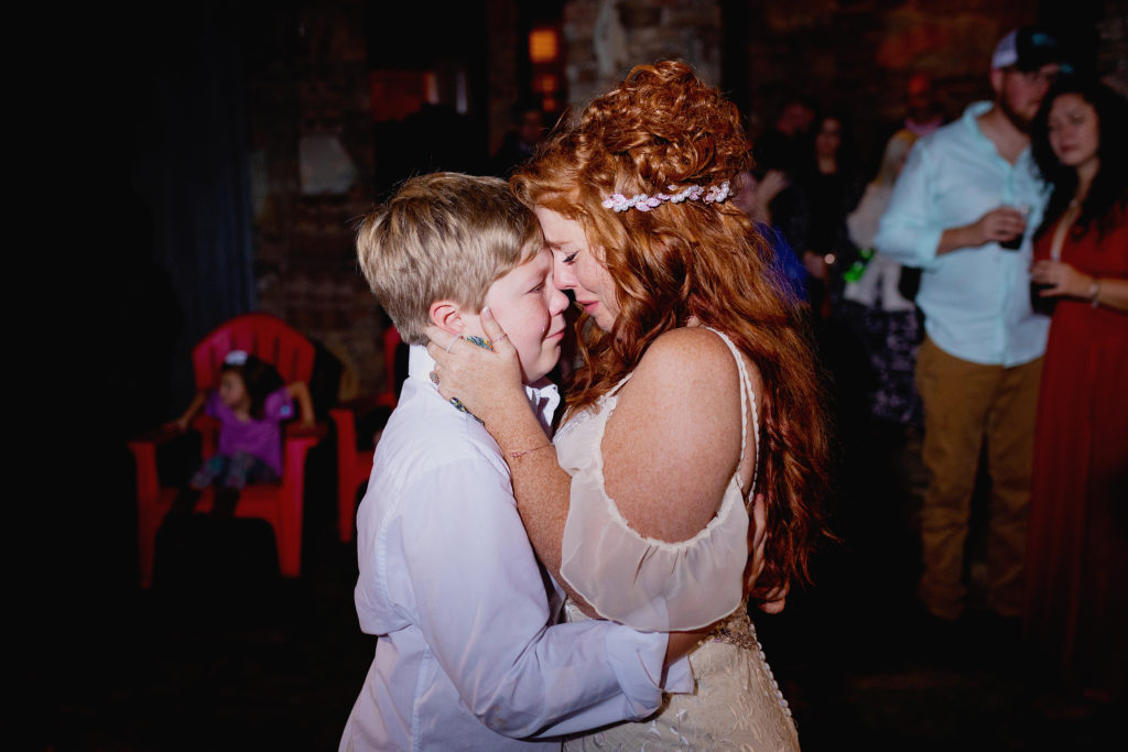 Bride dances with her son on her wedding day and shares a sweet, moving, moment, where they both shed tears of joy.