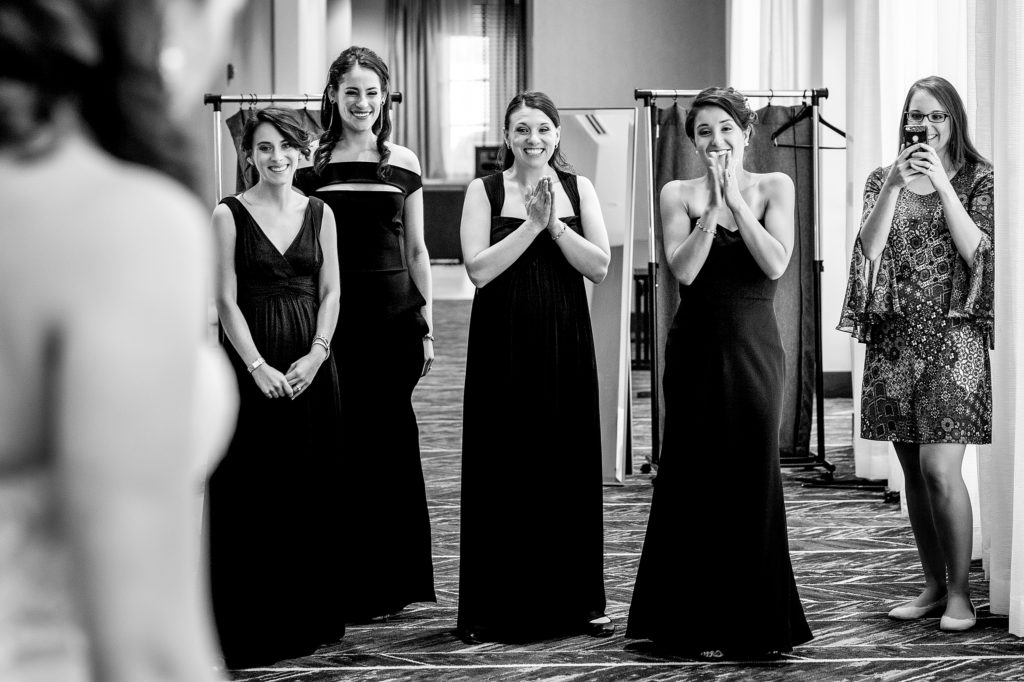 First look with bridesmaids on wedding day, at Hilton Garden Inn-South Park Charlotte NC