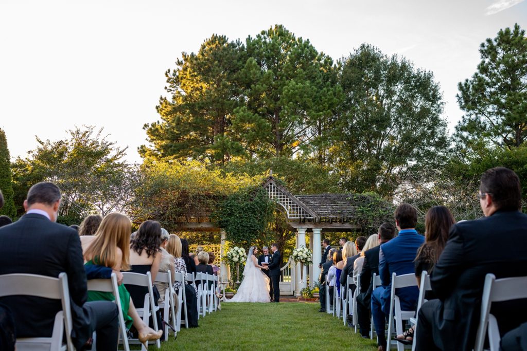 Ceremony at Daniel Stowe Botanical Gardens in the White Garden. Greenhouse and garden weddings
