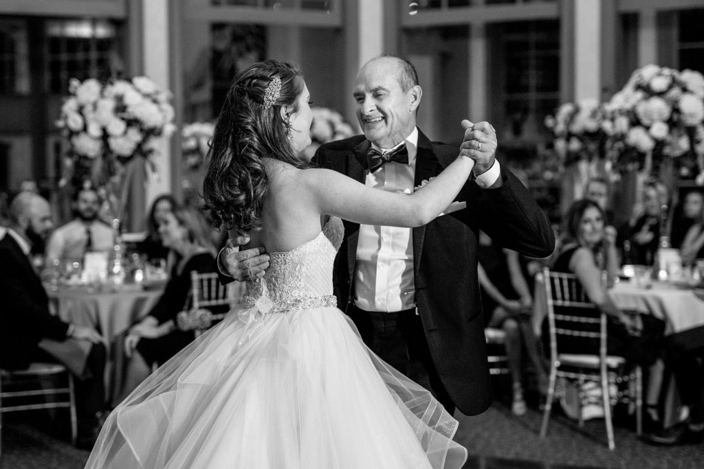 Daddy, daughter dance at her wedding. Daniel Stowe Botanical Gardens wedding reception. Greenhouse and garden weddings